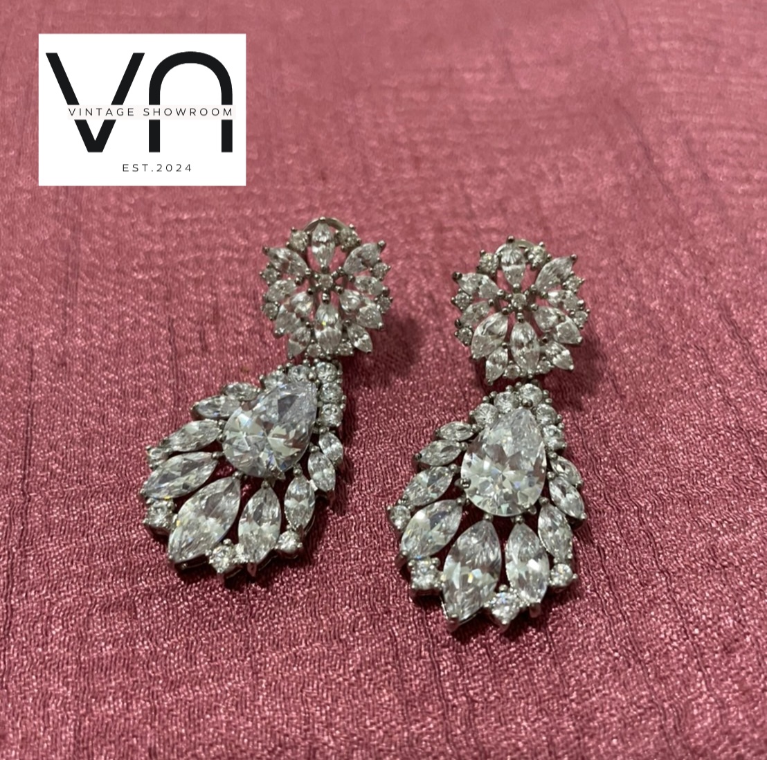 Crystal Earrings. Pear-shapedcenter crystals in a gorgeous floral pattern.