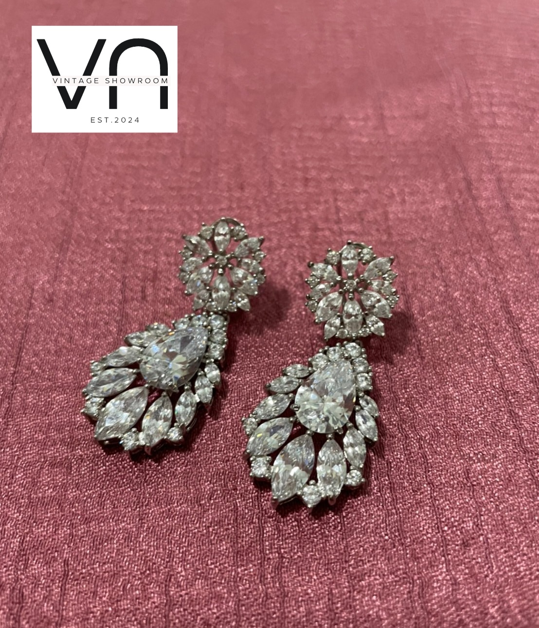 Crystal Earrings. Pear-shapedcenter crystals in a gorgeous floral pattern.