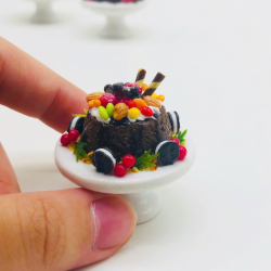 Miniature Sweet cake on ceramic stand