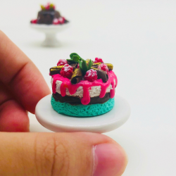 Miniature Sweet cake on ceramic stand