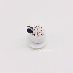 Tiny coffee cup with saucer