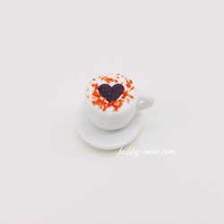 Tiny coffee cup with saucer