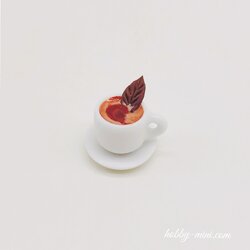 Tiny coffee cup with saucer