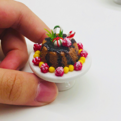 Miniature Sweet cake on ceramic stand